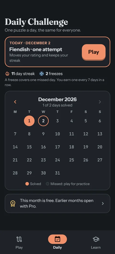 The Daily Challenge: today's puzzle with one attempt, an eleven-day streak with two freezes, and the month's calendar